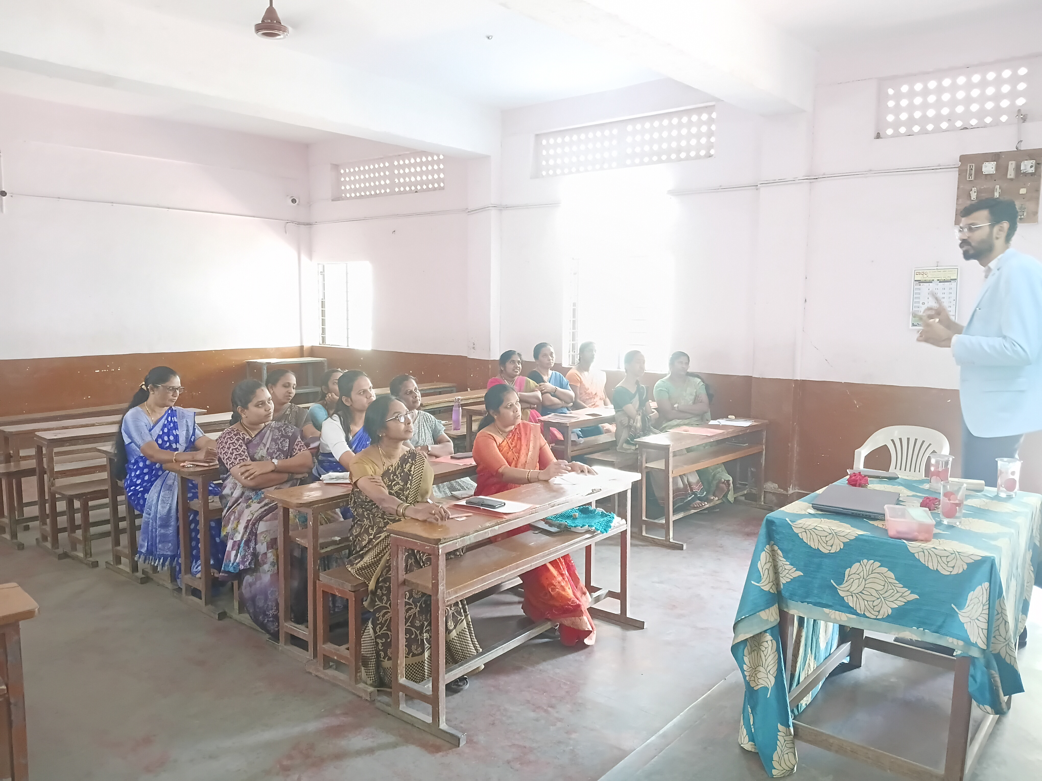 Resource person interacting with participating teachers